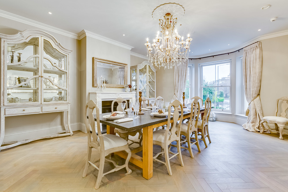 Inspiration for a medium sized classic dining room in London with beige walls, light hardwood flooring and beige floors.