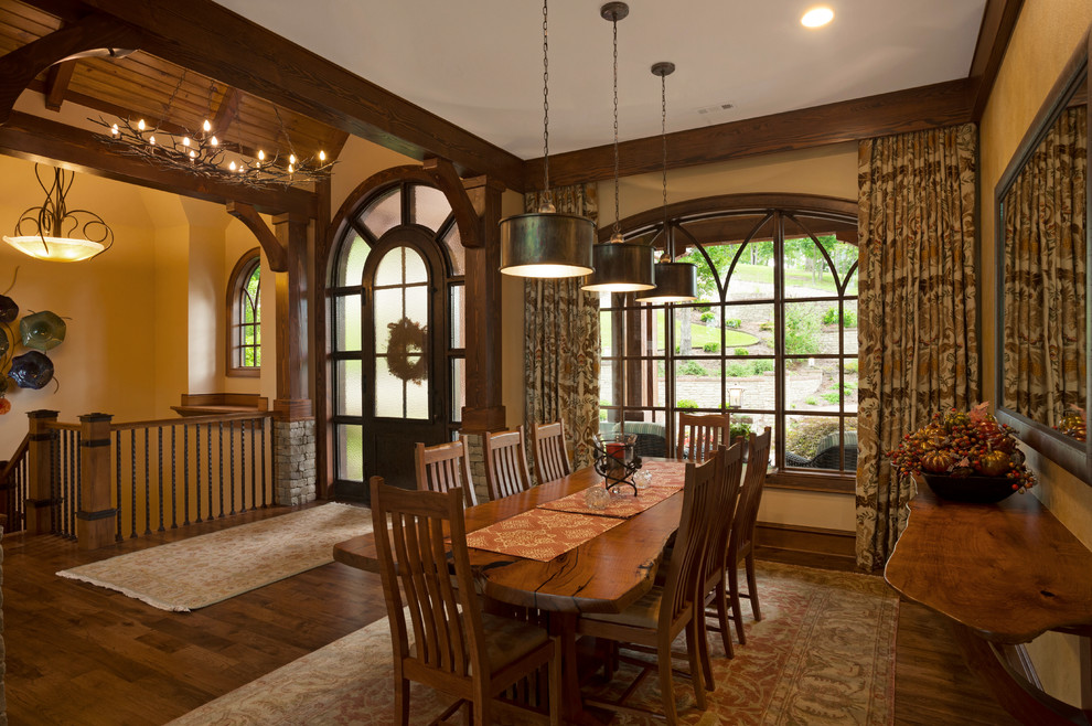 Photo of a large classic open plan dining room in Other with yellow walls and medium hardwood flooring.