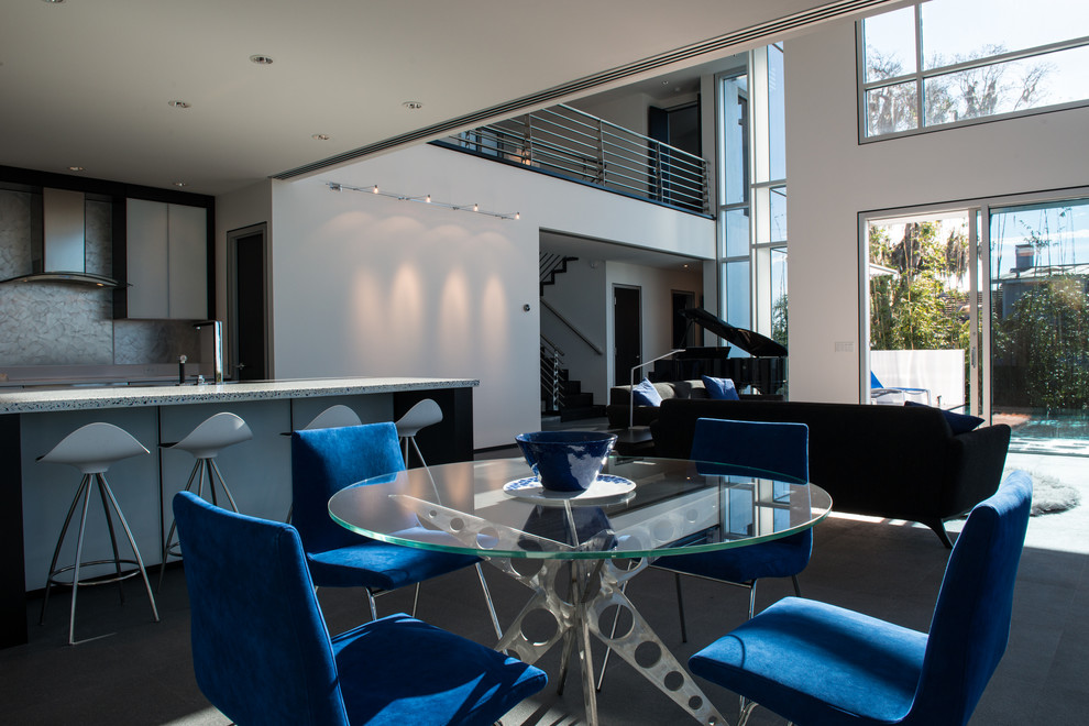 Свежая идея для дизайна: большая гостиная-столовая в стиле модернизм с белыми стенами и полом из керамогранита - отличное фото интерьера