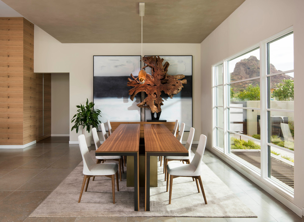 Large contemporary kitchen/dining room in Phoenix with white walls, limestone flooring and beige floors.