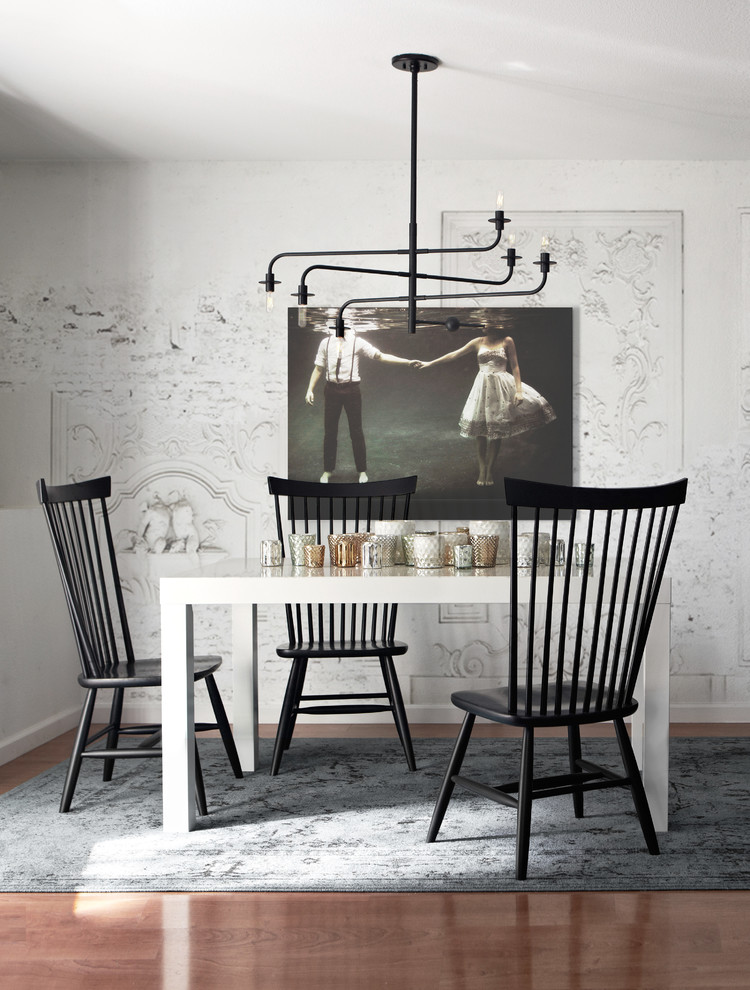 Example of a danish dark wood floor dining room design in San Francisco with white walls