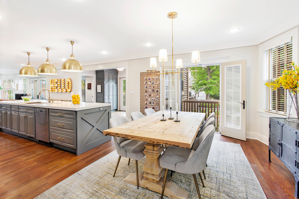 Farmhouse kitchen/dining room in New York with white walls, medium hardwood flooring and brown floors.
