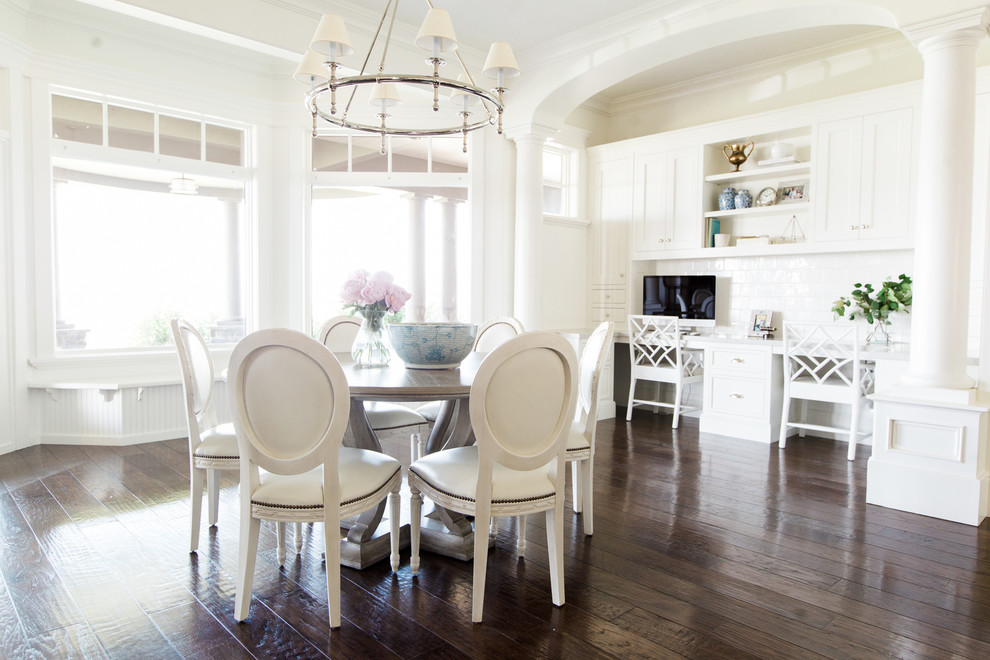 Example of a large classic dark wood floor dining room design in Salt Lake City with white walls
