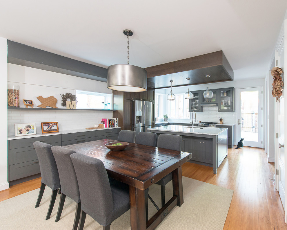 Mid-sized transitional light wood floor and orange floor kitchen/dining room combo photo in DC Metro with white walls