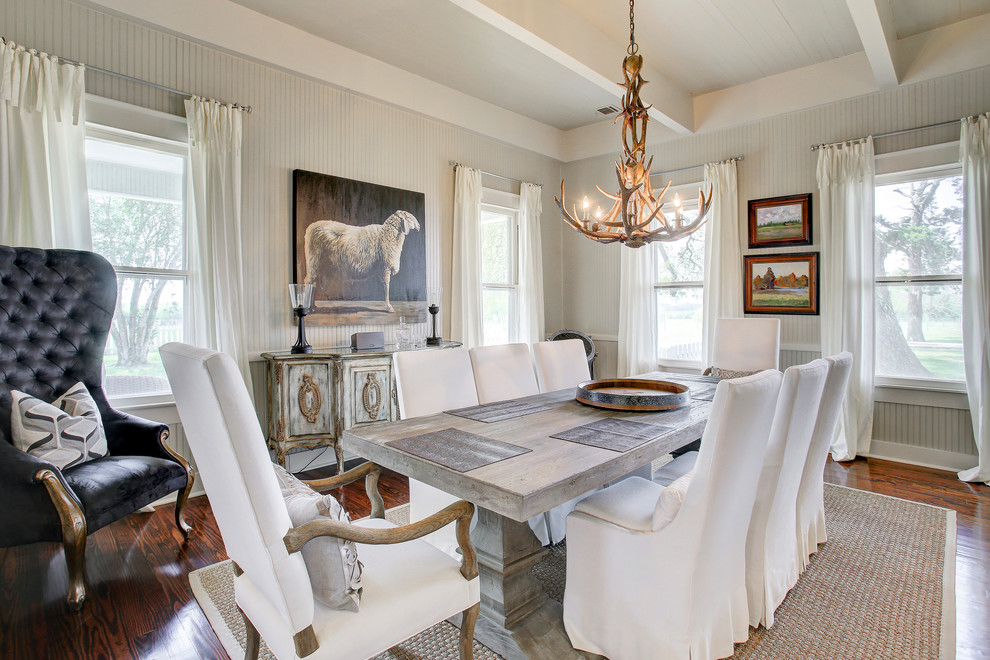 Inspiration for a traditional dining room in Houston with beige walls, dark hardwood flooring and brown floors.
