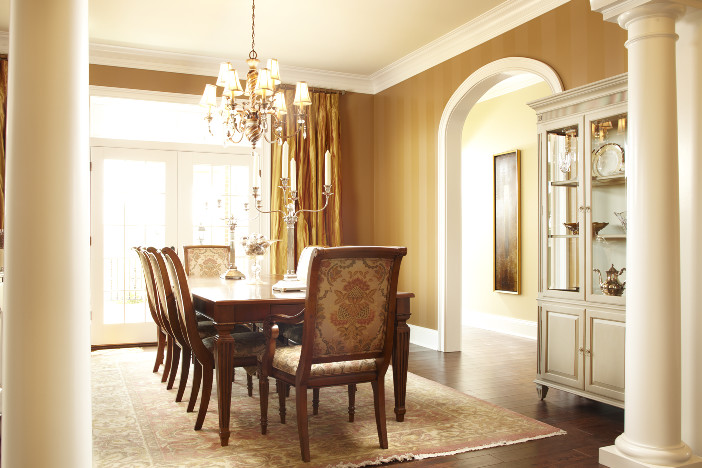 Large classic enclosed dining room in Los Angeles with brown walls, medium hardwood flooring, no fireplace and brown floors.