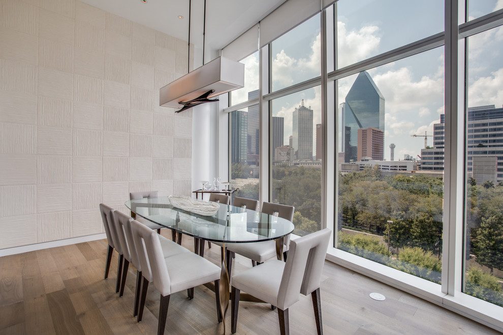 Inspiration for a large contemporary enclosed dining room in Dallas with white walls, medium hardwood flooring, no fireplace and brown floors.