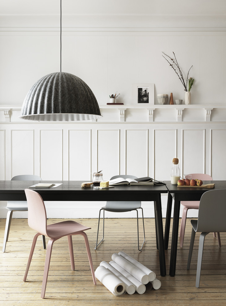 This is an example of a medium sized scandinavian dining room in Sydney with white walls and light hardwood flooring.