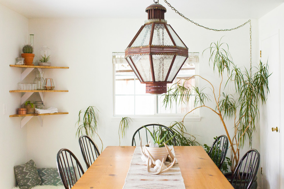 Inspiration for a dining room in Seattle with white walls, no fireplace and feature lighting.
