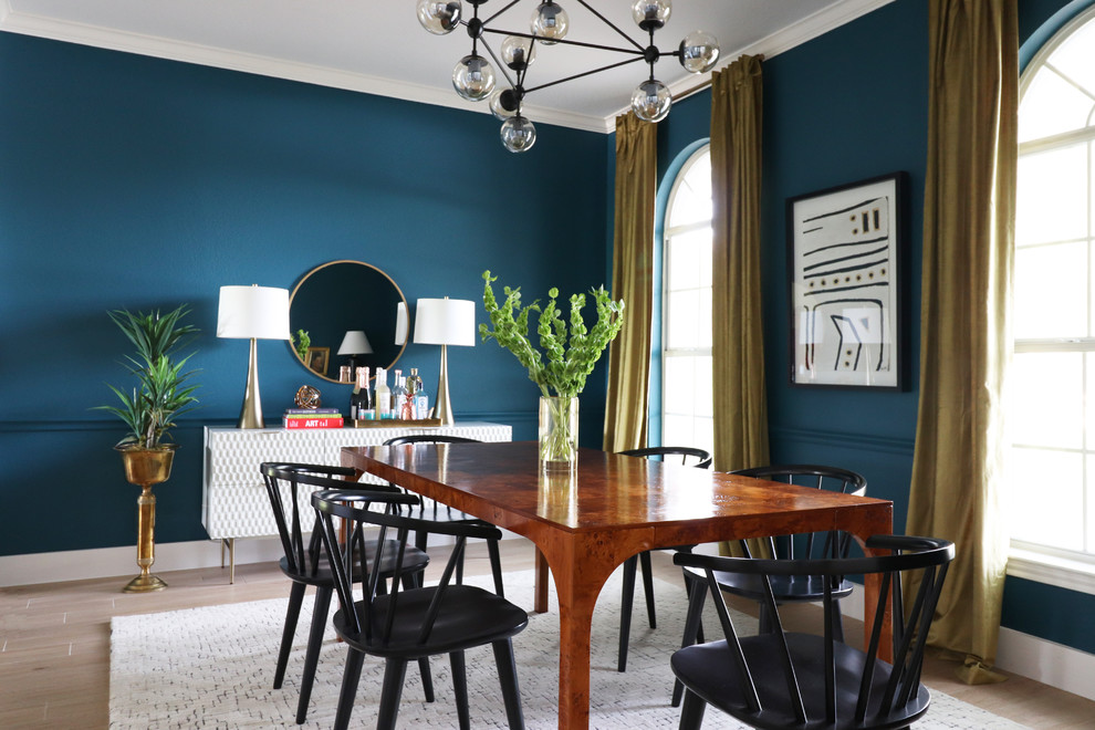Inspiration for a transitional beige floor and light wood floor dining room remodel in Austin with blue walls