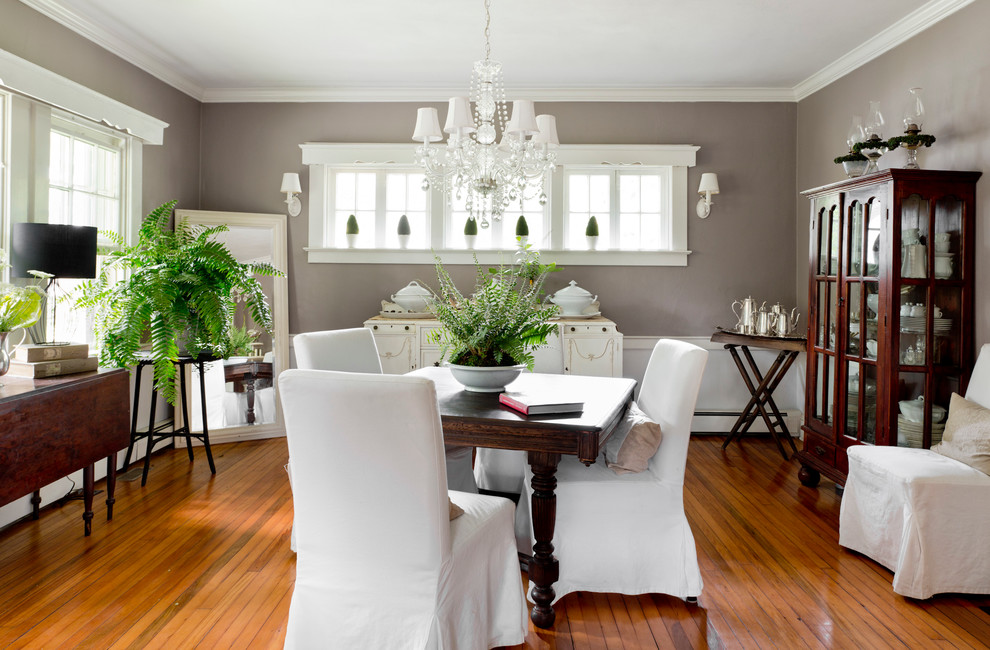 Design ideas for a traditional dining room in New York with feature lighting.