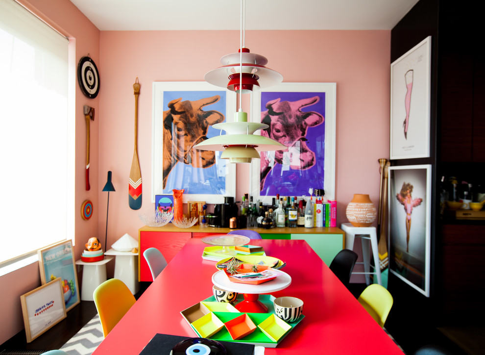 Inspiration for an eclectic dining room in New York with feature lighting.