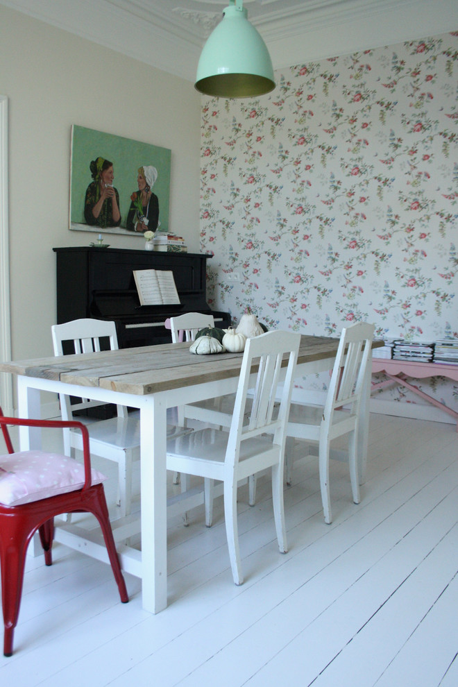 Example of an eclectic painted wood floor dining room design in Amsterdam with white walls