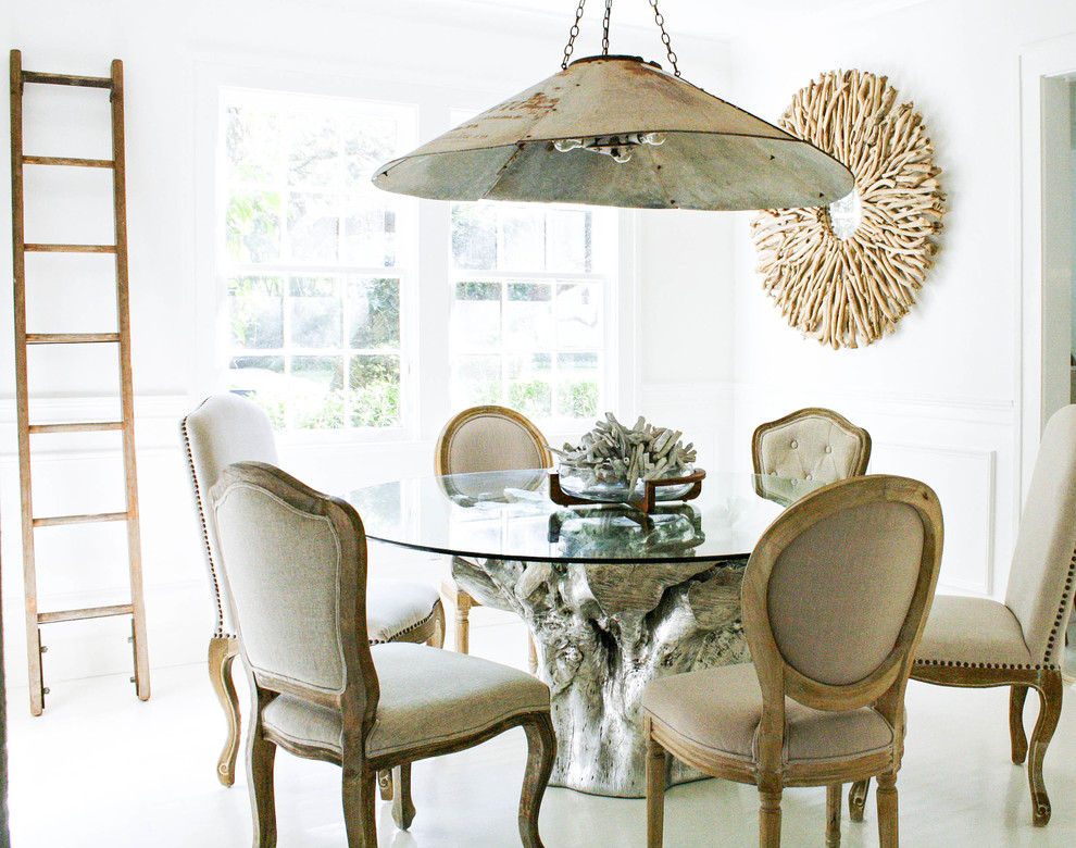 Design ideas for a bohemian dining room in Tampa with white walls.