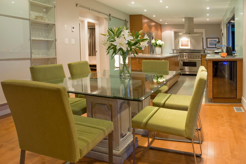 Trendy medium tone wood floor kitchen/dining room combo photo in Vancouver with beige walls