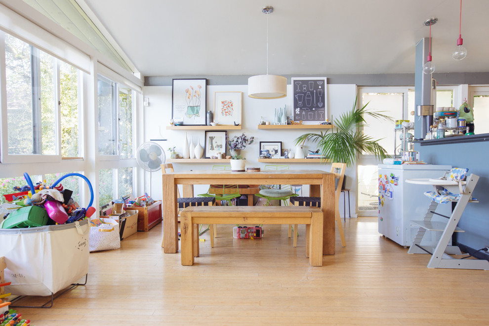 Inspiration for a 1950s light wood floor great room remodel in San Francisco with white walls