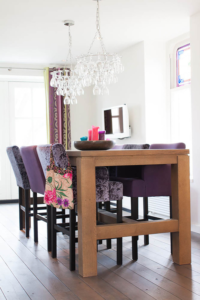 Photo of a contemporary dining room in Amsterdam with white walls.