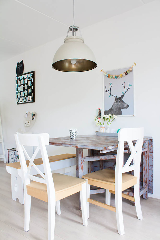Danish dining room photo in Amsterdam with white walls
