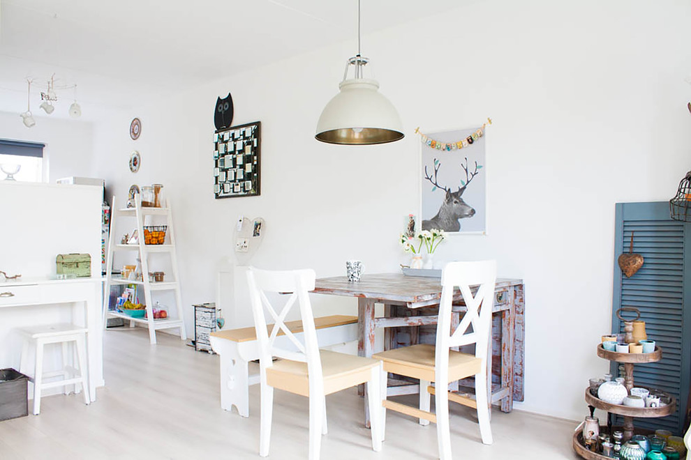 Example of an eclectic dining room design in Amsterdam