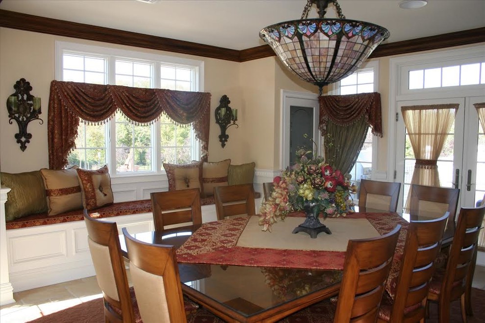 Medium sized classic dining room in New York with beige walls, limestone flooring and no fireplace.