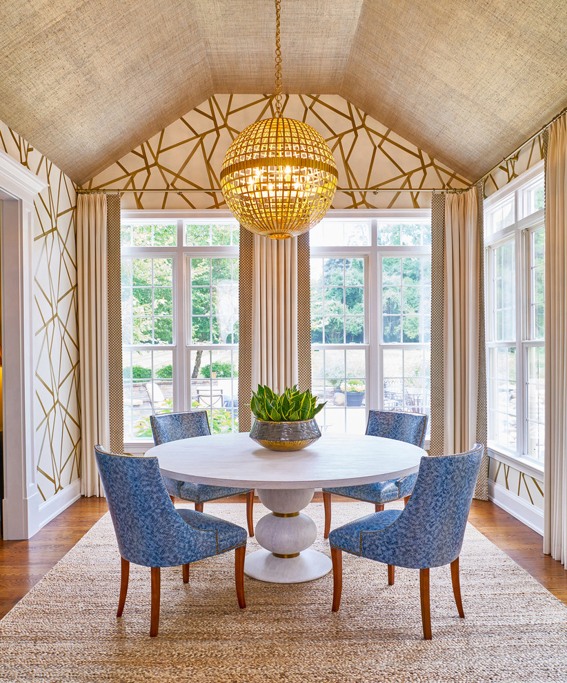 Example of a transitional dark wood floor and brown floor dining room design in New York with beige walls
