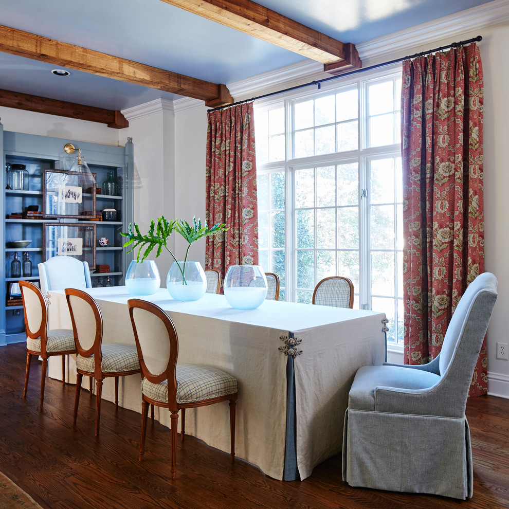 This is an example of a classic enclosed dining room in Other with beige walls, medium hardwood flooring and brown floors.