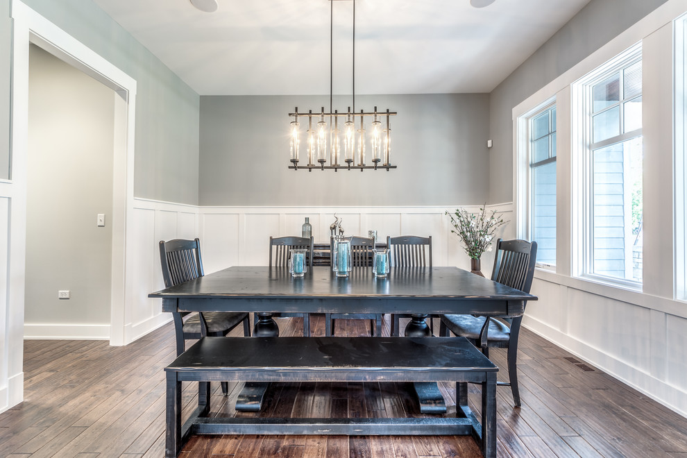 Example of a farmhouse dining room design in Chicago with gray walls