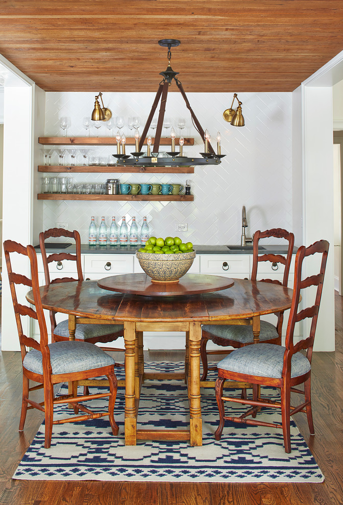 Dining room - mid-sized southwestern medium tone wood floor dining room idea in Atlanta with white walls