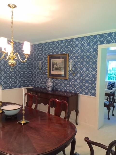 This is an example of a medium sized classic kitchen/dining room in Chicago with blue walls and carpet.