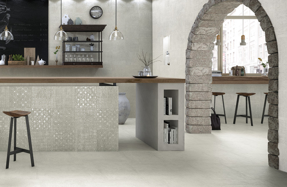 Diseño de comedor de cocina minimalista grande con paredes grises y suelo de baldosas de porcelana