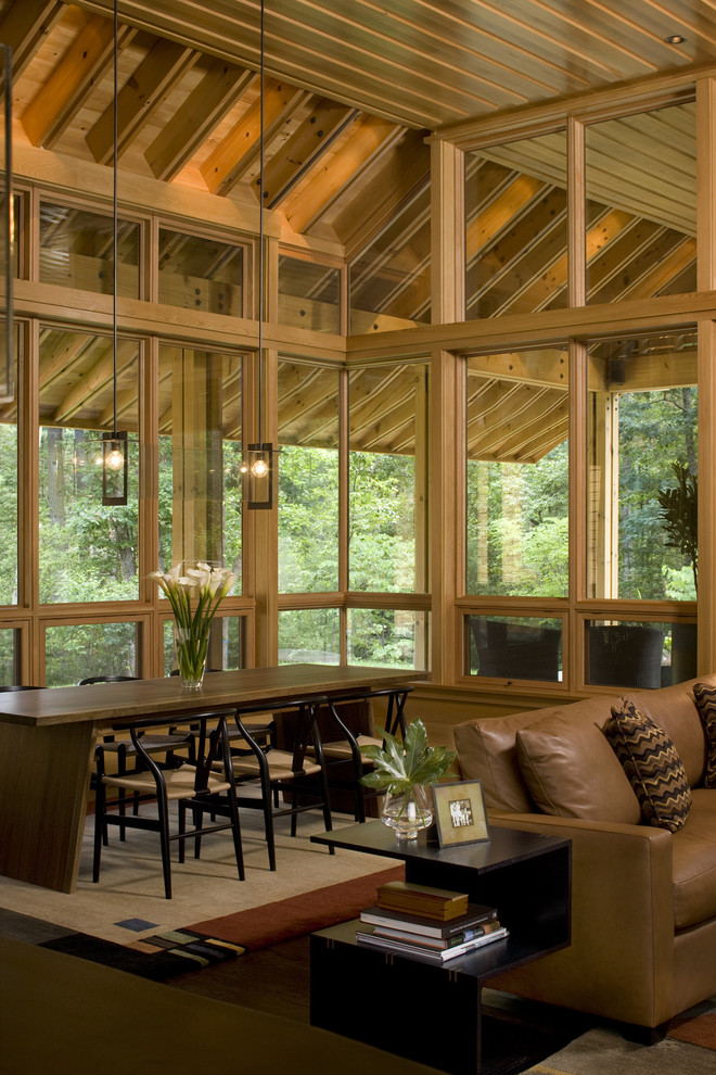 Example of a transitional dark wood floor and brown floor great room design in Charlotte with beige walls