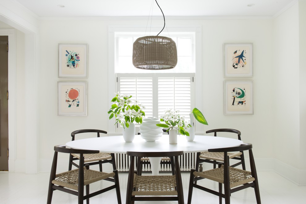 Inspiration for a scandinavian dining room remodel in New York with white walls and no fireplace