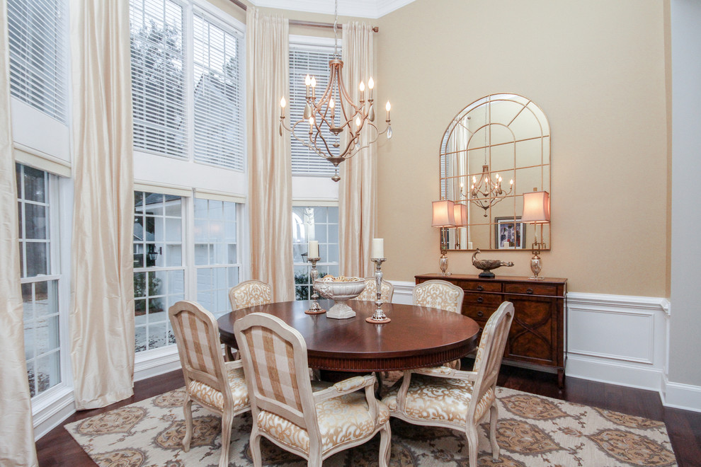 This is an example of a medium sized traditional enclosed dining room in Atlanta with beige walls, dark hardwood flooring and no fireplace.