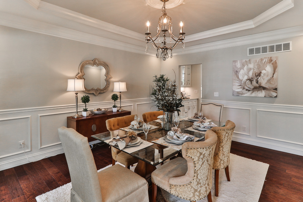 Inspiration for a medium sized traditional enclosed dining room in St Louis with grey walls, dark hardwood flooring, no fireplace and brown floors.