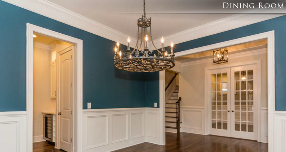Example of a mid-sized transitional dark wood floor enclosed dining room design in Raleigh with blue walls
