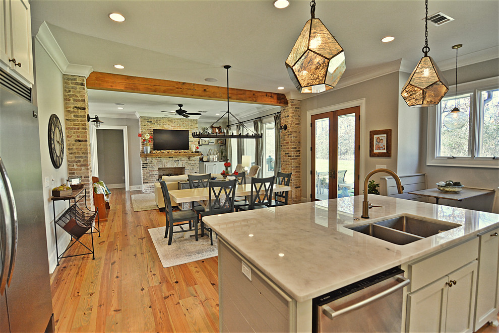 This is an example of a medium sized farmhouse kitchen/dining room in Jackson with beige walls, medium hardwood flooring, no fireplace and brown floors.