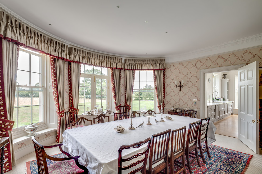 Inspiration for a medium sized traditional enclosed dining room in Gloucestershire with multi-coloured walls, carpet and beige floors.