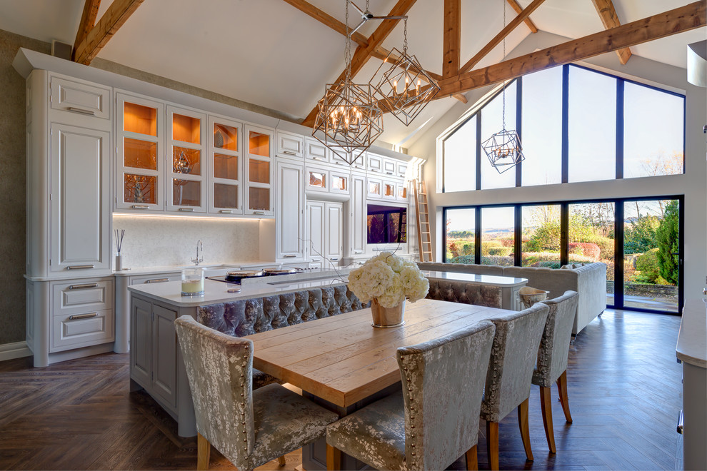 Expansive rural kitchen/dining room in Other with vinyl flooring and brown floors.