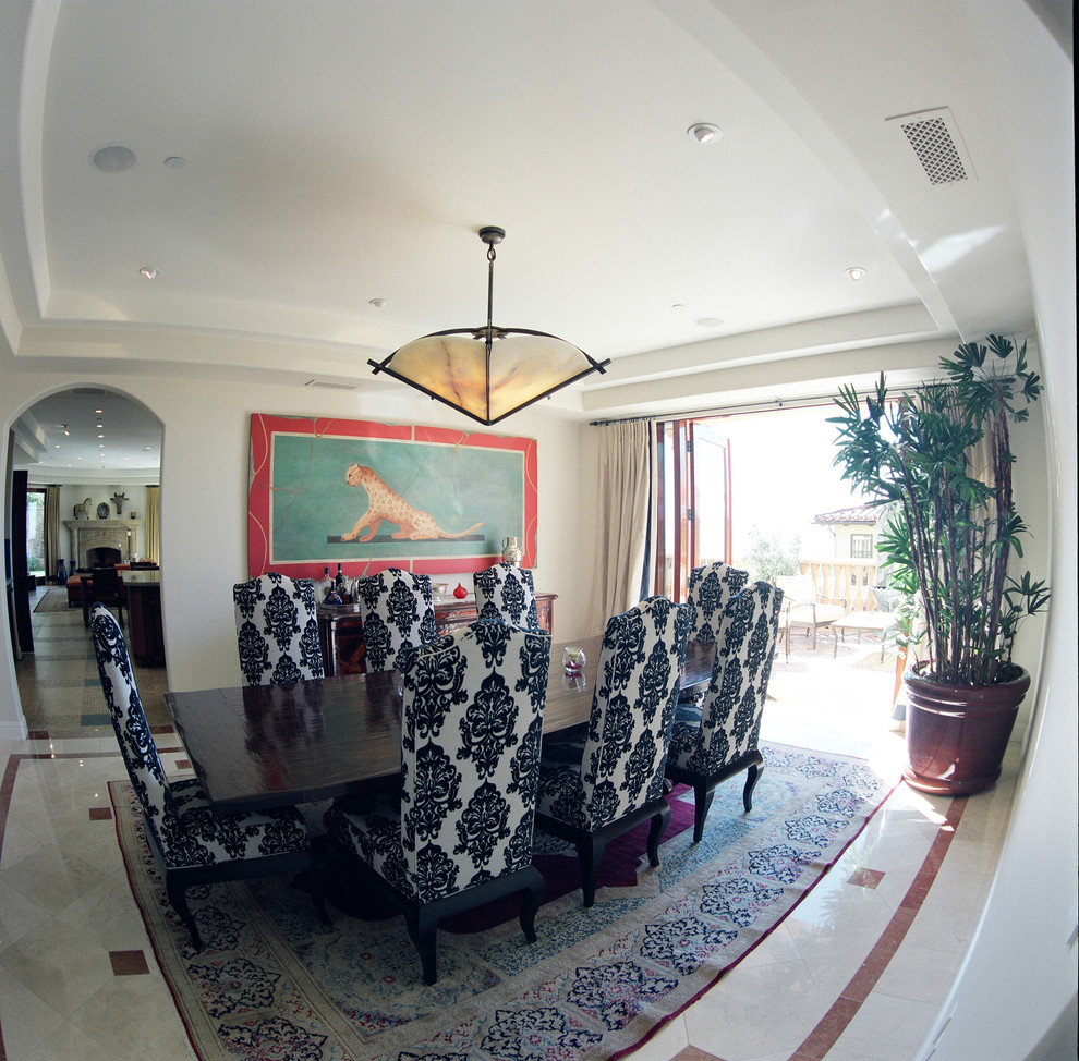 Inspiration for a large mediterranean marble floor enclosed dining room remodel in Los Angeles with white walls