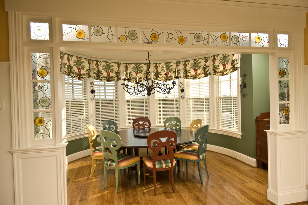 Inspiration for a traditional enclosed dining room in Bridgeport with green walls and dark hardwood flooring.