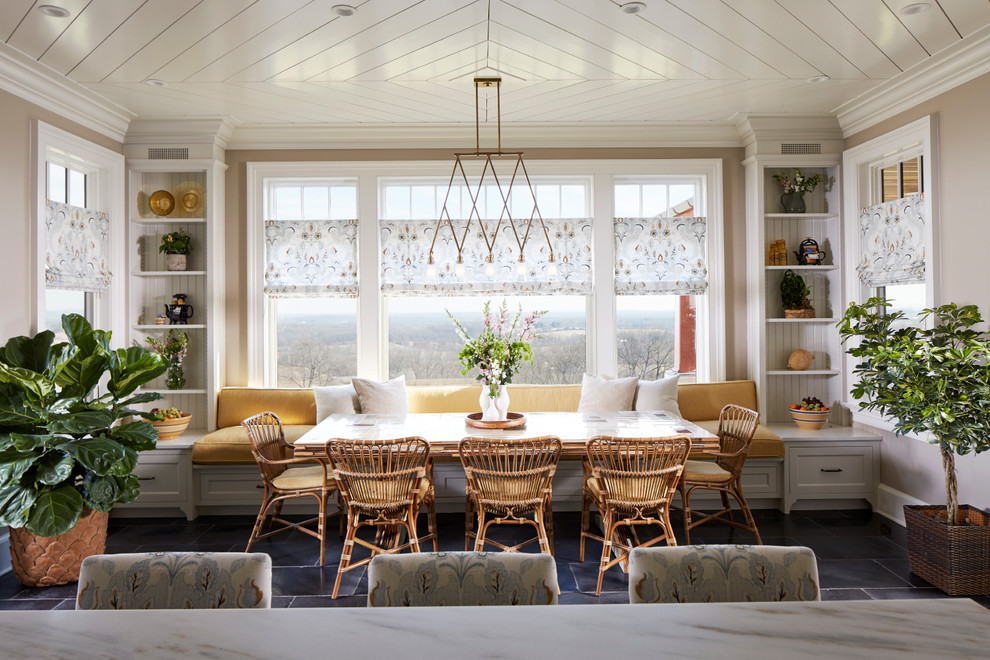 Kitchen/dining room combo - mid-sized farmhouse black floor and limestone floor kitchen/dining room combo idea in New York with beige walls