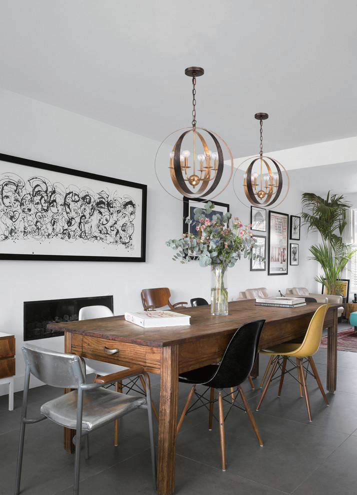 Rustic open plan dining room in Other with white walls.