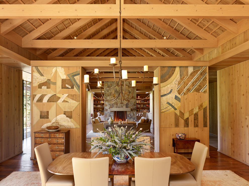 Idée de décoration pour une salle à manger champêtre avec un sol en bois brun.