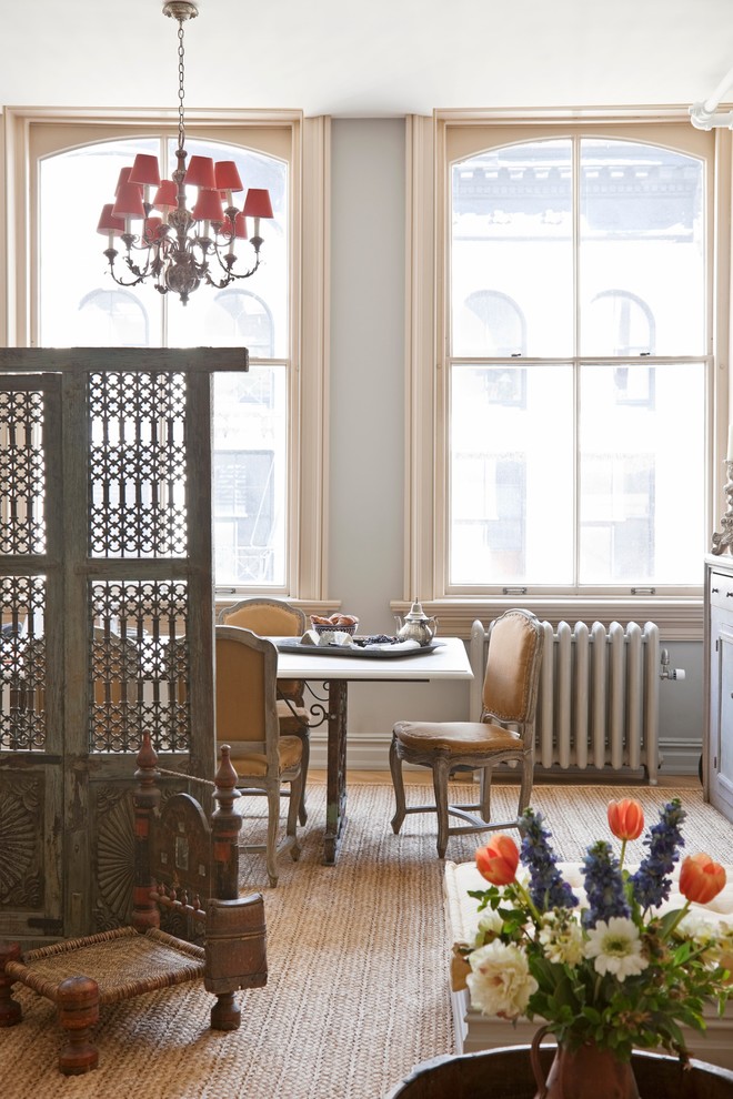 Inspiration for a victorian dining room remodel in New York with gray walls