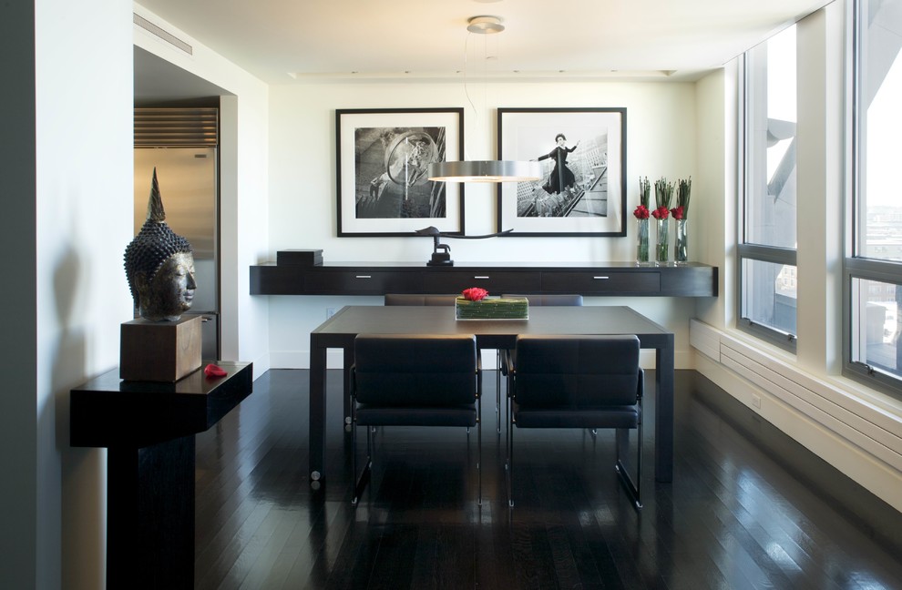 Inspiration for a mid-sized contemporary black floor and dark wood floor enclosed dining room remodel in Boston with white walls and no fireplace