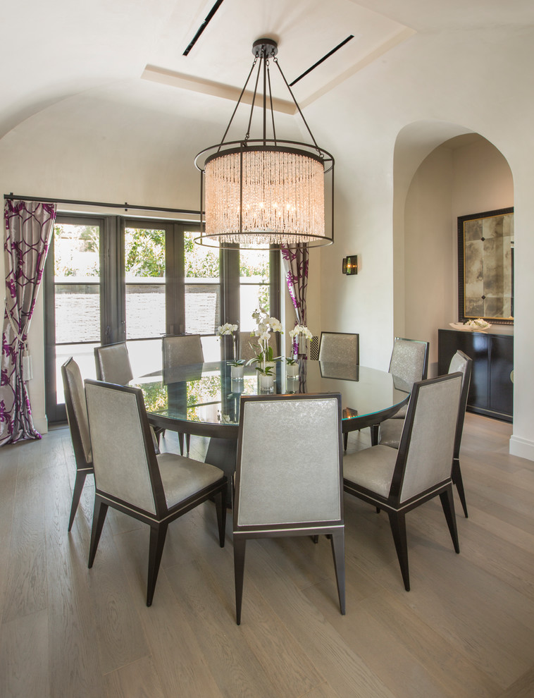 Inspiration for a contemporary light wood floor and beige floor dining room remodel in Orange County with beige walls