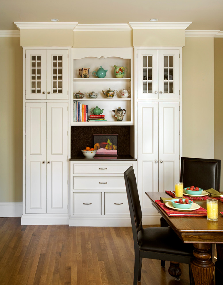 Large elegant medium tone wood floor kitchen/dining room combo photo in Boston with beige walls