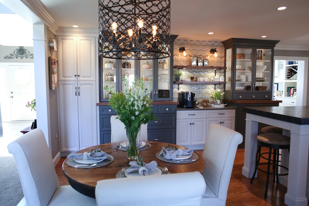 Example of a large eclectic medium tone wood floor and brown floor kitchen/dining room combo design in Philadelphia
