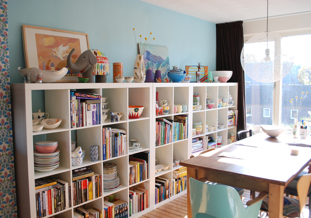 Inspiration for a contemporary dining room remodel in Amsterdam with blue walls and no fireplace