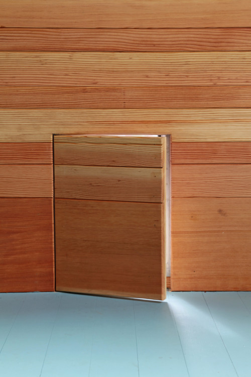 the dog door is seamlessly built into the design. Inspired by Danish simplicity